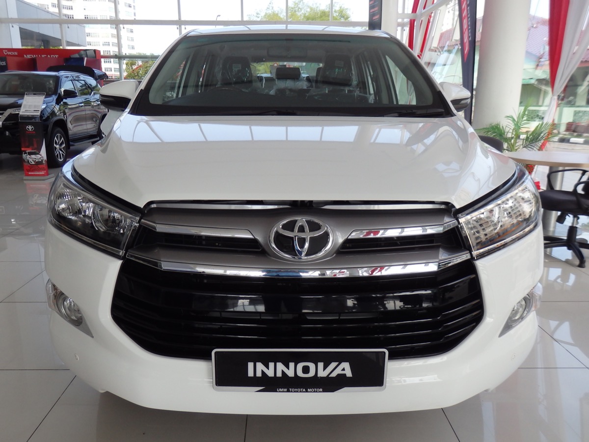 Toyota Innova MPV taxi — silver front view for family outstation trips
